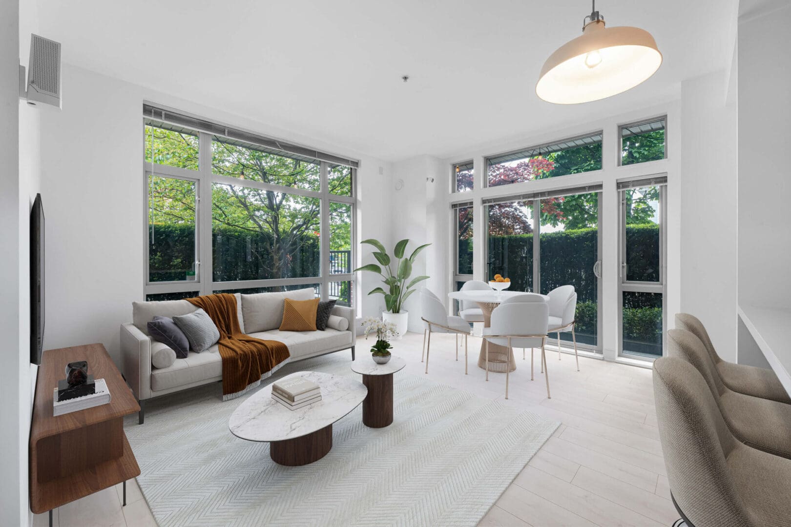 A living room with white walls and furniture.