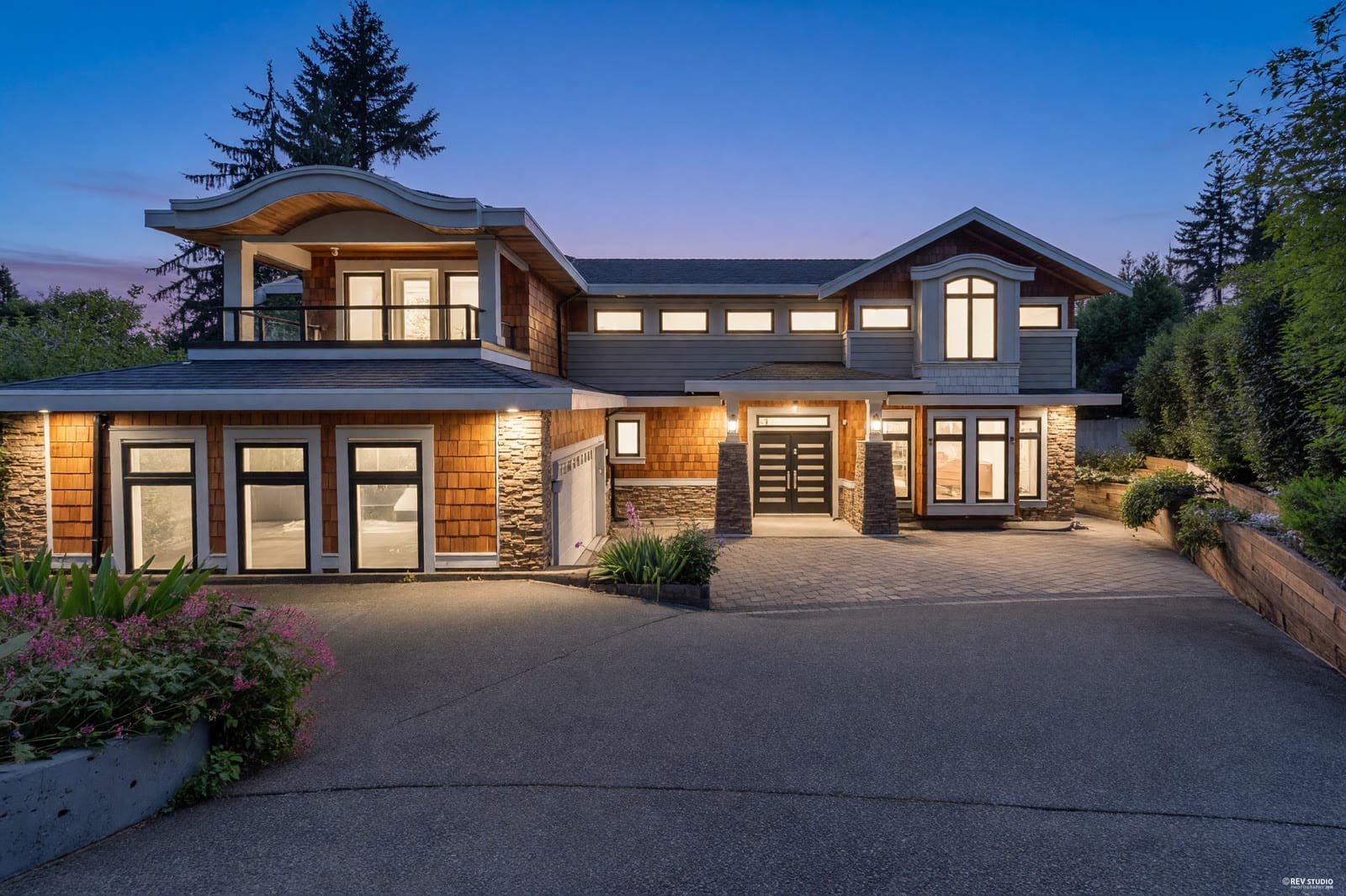 Twilight exterior photo of a craftsman luxury home by REV Studio